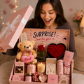 Gift box arrangement with plush teddy bear, roses and candle